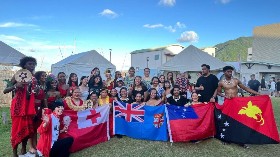 Students after performing traditional dances and other acts at an event in Beppu City.