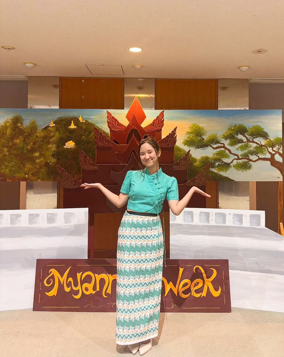 May smiling in a her traditional htamein